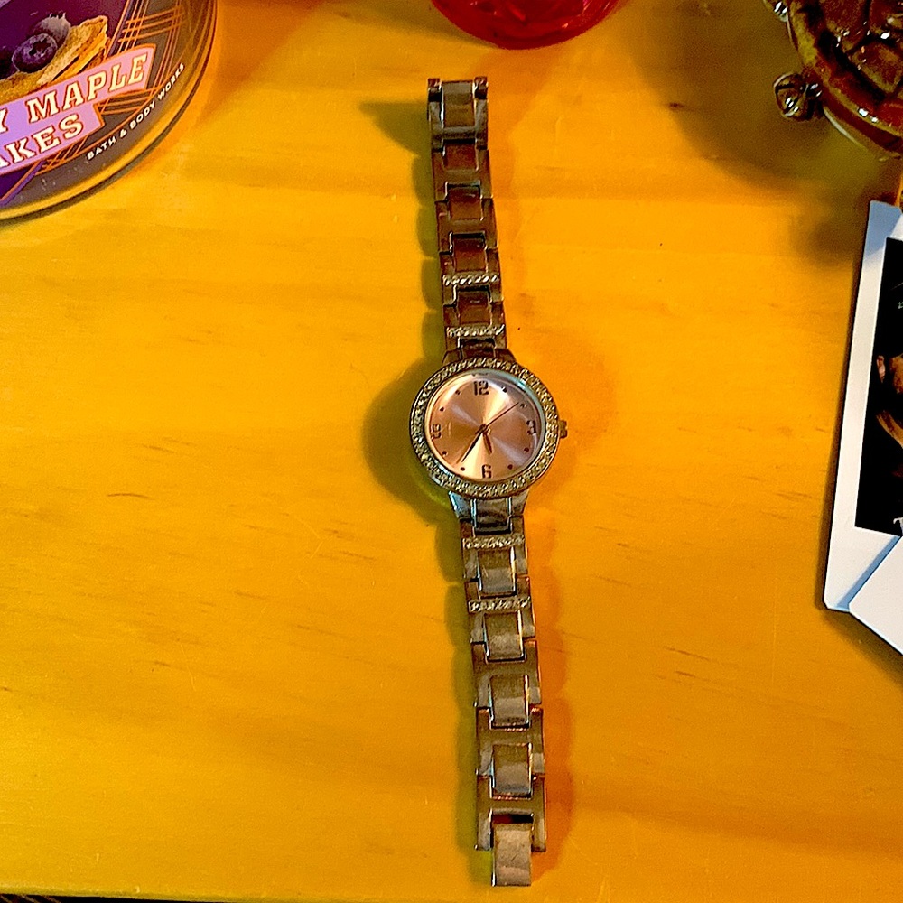 A woman watch rose gold and silver size small has a few discolor spots